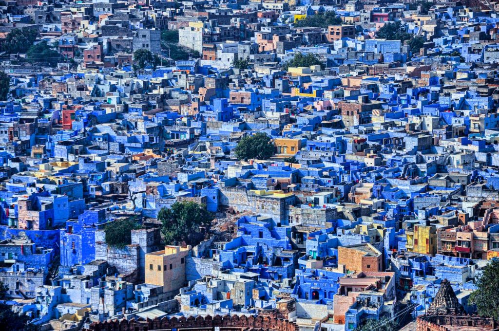 a large group of blue buildings in a city
